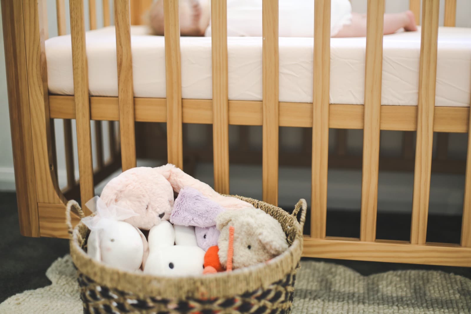 A peaceful nursery with a baby asleep in the crib